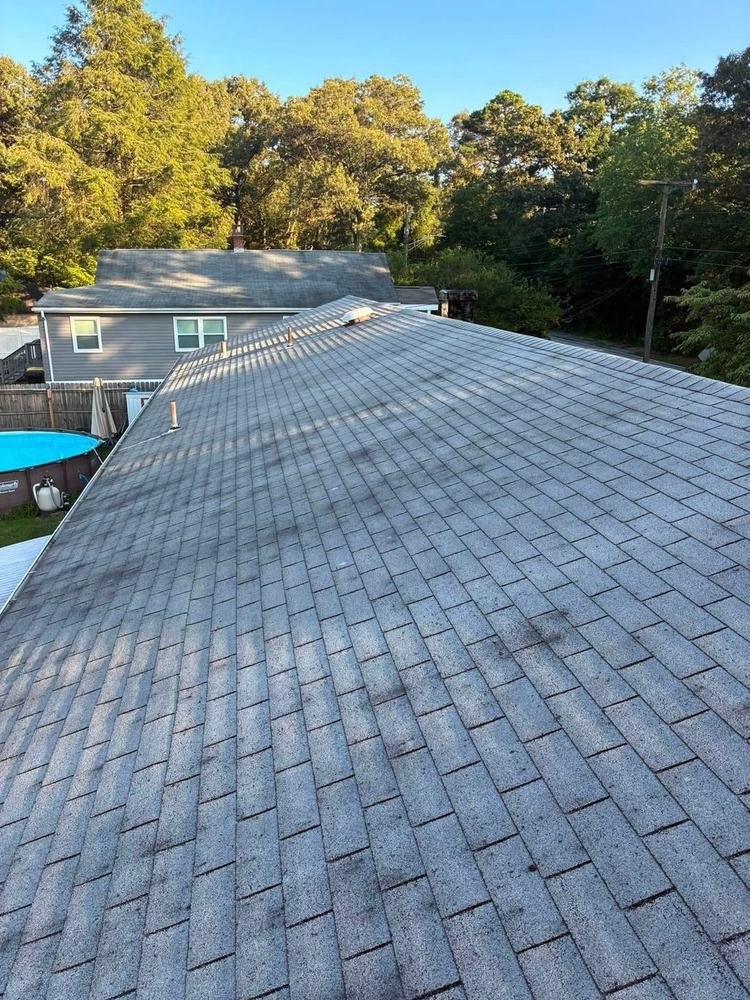 Worn, aging asphalt shingle roof before replacement by Magothy Roofing and Exteriors